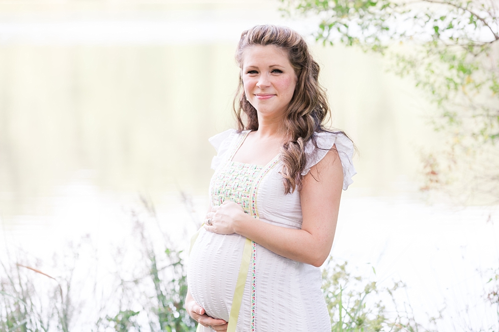 Raleigh, NC maternity photos taken by Traci Huffman Photography at Yates Mill in moms wedding dress