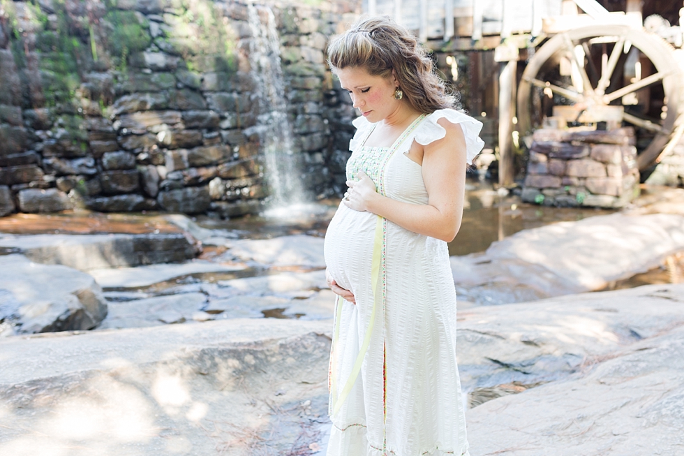 Raleigh, NC maternity photos taken by Traci Huffman Photography at Yates Mill in moms wedding dress