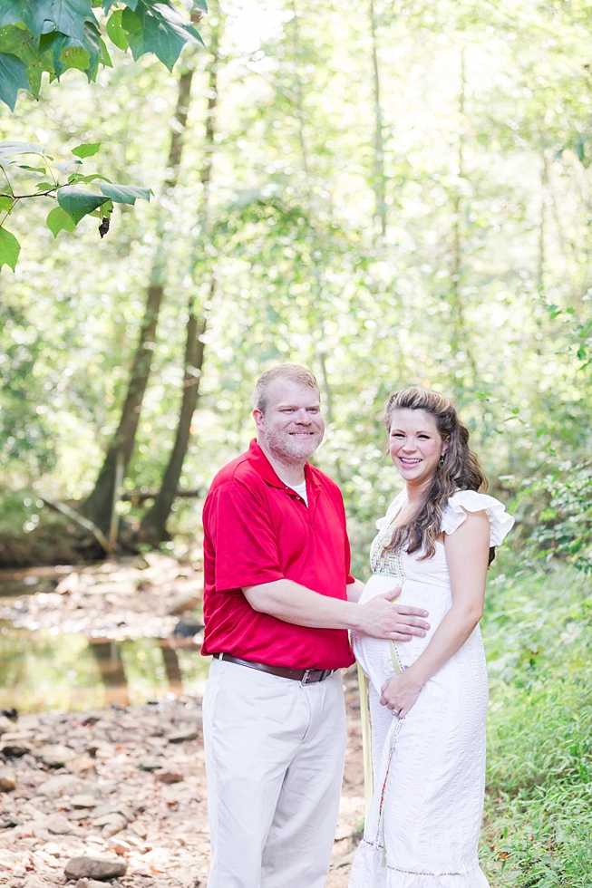 Raleigh, NC maternity photos taken by Traci Huffman Photography at Yates Mill in moms wedding dress