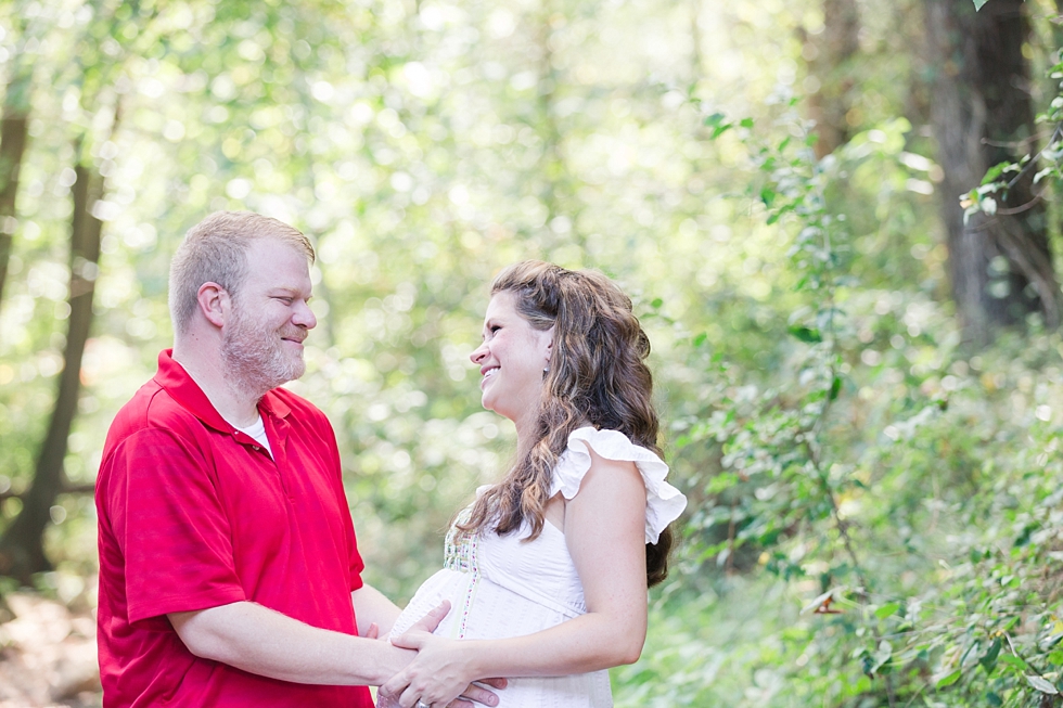 Raleigh, NC maternity photos taken by Traci Huffman Photography at Yates Mill in moms wedding dress