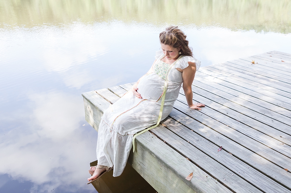 Raleigh, NC maternity photos taken by Traci Huffman Photography at Yates Mill in moms wedding dress