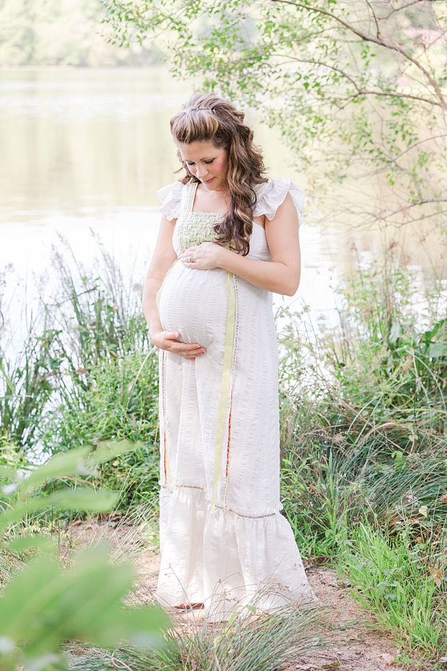 Raleigh, NC maternity photos taken by Traci Huffman Photography at Yates Mill in moms wedding dress