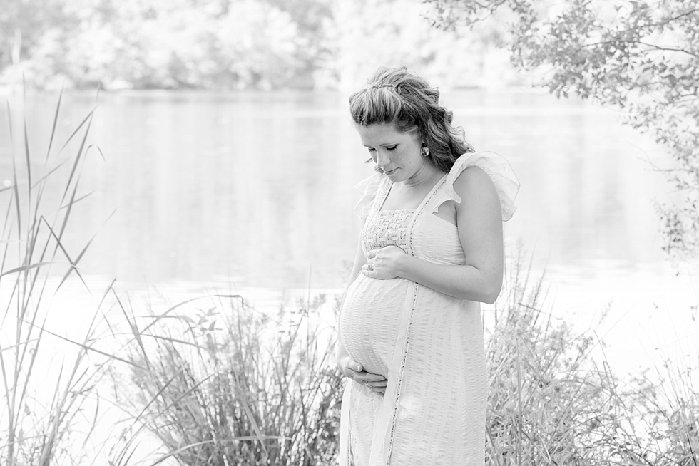 Raleigh, NC maternity photos taken by Traci Huffman Photography at Yates Mill in moms wedding dress