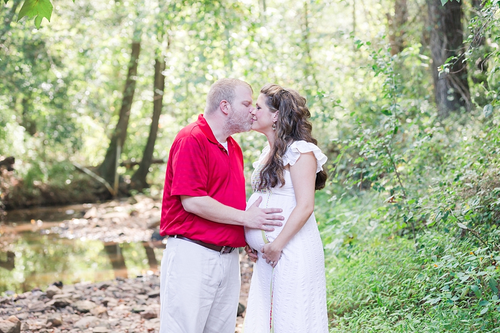 Raleigh, NC maternity photos taken by Traci Huffman Photography at Yates Mill in moms wedding dress