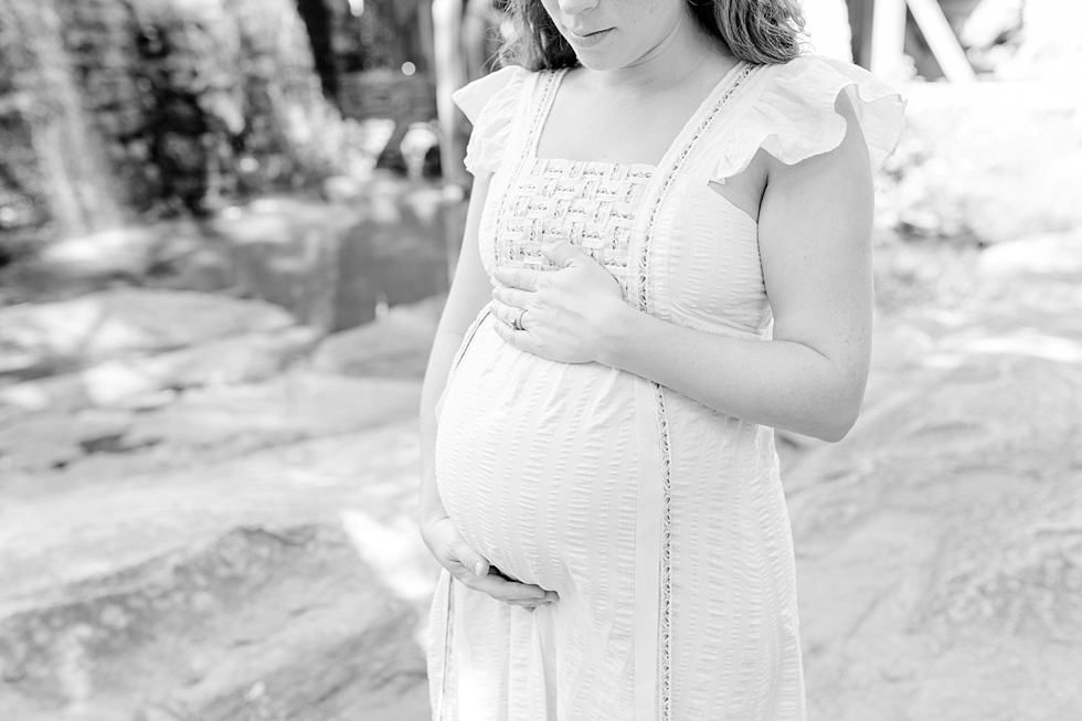 Raleigh, NC maternity photos taken by Traci Huffman Photography at Yates Mill in moms wedding dress