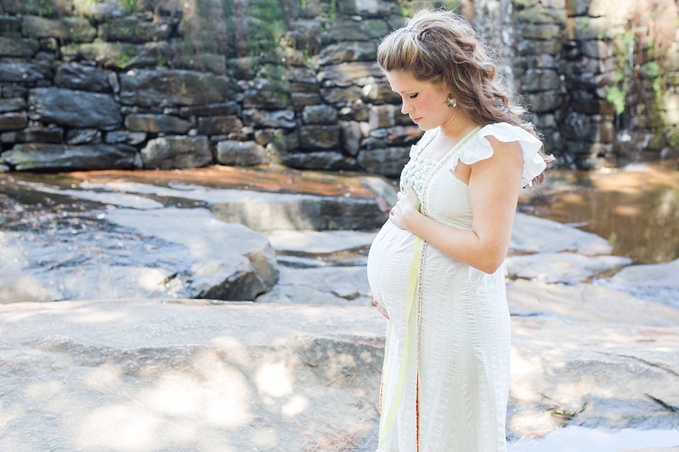 Raleigh, NC maternity photos taken by Traci Huffman Photography at Yates Mill in moms wedding dress